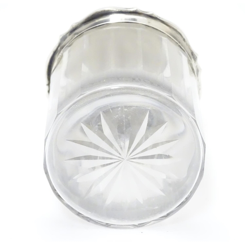 319 - A glass jar with silver lid hallmarked Birmingham 1914 3 1/4