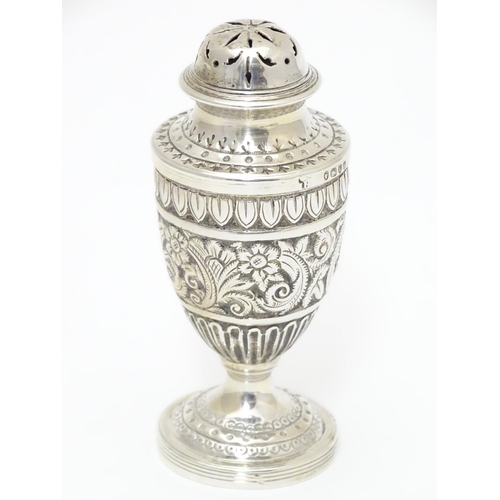 322 - A Victorian silver caster / pepperette  hallmarked London1886 maker Charles Stuart Harri. Approx 3 1... 