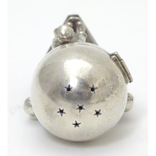 328 - A Russian silver Judaica besamim / balsaminka spice holder, the spice ball supported by three bowing... 