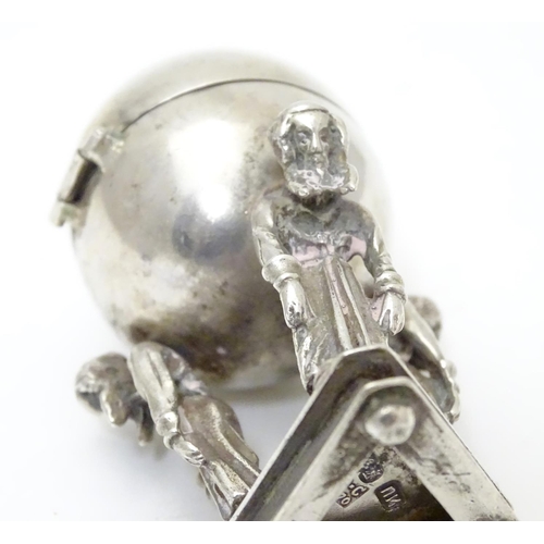 328 - A Russian silver Judaica besamim / balsaminka spice holder, the spice ball supported by three bowing... 