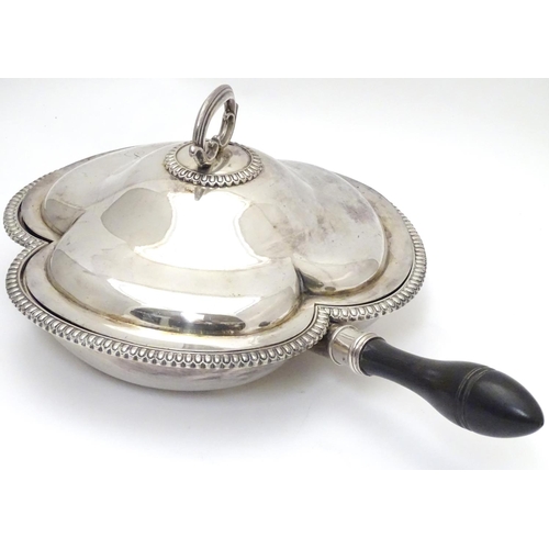 425 - A silver plate serving dish and cover of trefoil form with three sections within and having ebonised... 