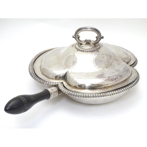 425 - A silver plate serving dish and cover of trefoil form with three sections within and having ebonised... 