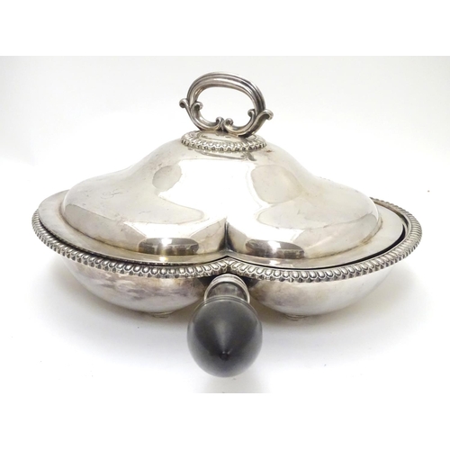 425 - A silver plate serving dish and cover of trefoil form with three sections within and having ebonised... 