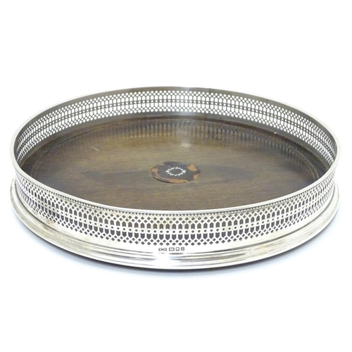 431 - A silver tray with with turned wooden base  Hallmarked London 1992 maker Whitehill Silver & Plate Co... 