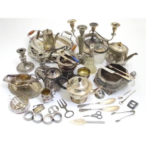 433A - A large equanimity of assorted silver plated wares to include candlesticks, flatware, serving dishes... 