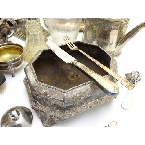 433A - A large equanimity of assorted silver plated wares to include candlesticks, flatware, serving dishes... 