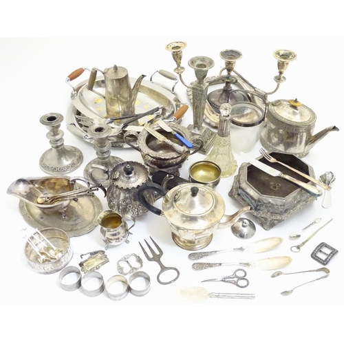 433A - A large equanimity of assorted silver plated wares to include candlesticks, flatware, serving dishes... 