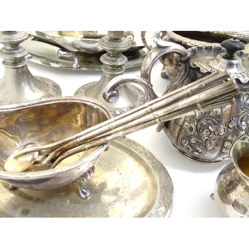 433A - A large equanimity of assorted silver plated wares to include candlesticks, flatware, serving dishes... 