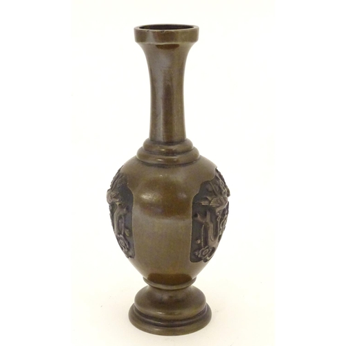 847 - An Oriental bronze vase of baluster form with a stepped base and neck, the body with cast vignettes ... 