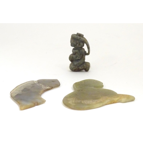 848 - Three Chinese stone carvings / amulets / pendants, comprising a carved kneeling figure, a stylised f... 