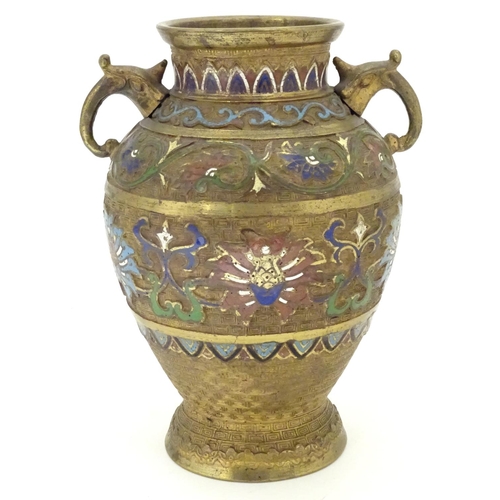 855 - A Japanese gilded brass vase of ovoid form with twin handles and cloisonne decoration. Approx. 9 1/2... 