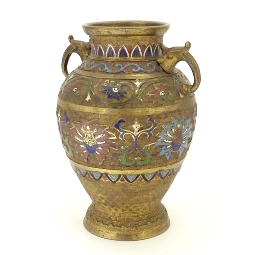 855 - A Japanese gilded brass vase of ovoid form with twin handles and cloisonne decoration. Approx. 9 1/2... 