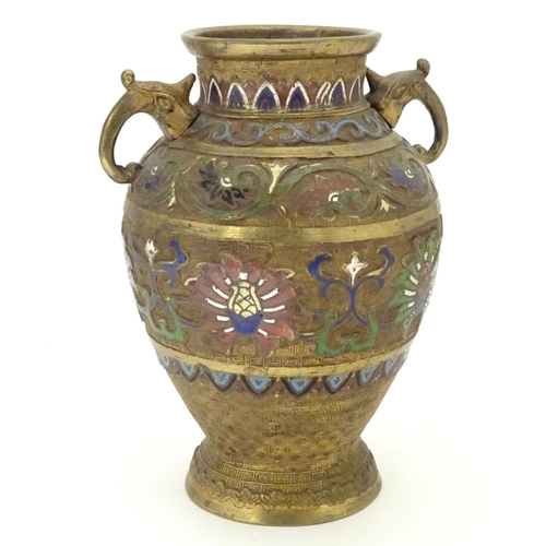 855 - A Japanese gilded brass vase of ovoid form with twin handles and cloisonne decoration. Approx. 9 1/2... 