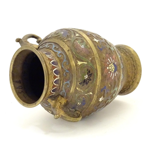 855 - A Japanese gilded brass vase of ovoid form with twin handles and cloisonne decoration. Approx. 9 1/2... 