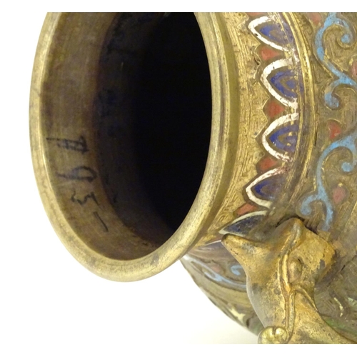 855 - A Japanese gilded brass vase of ovoid form with twin handles and cloisonne decoration. Approx. 9 1/2... 