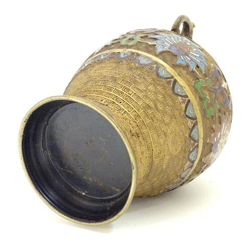 855 - A Japanese gilded brass vase of ovoid form with twin handles and cloisonne decoration. Approx. 9 1/2... 