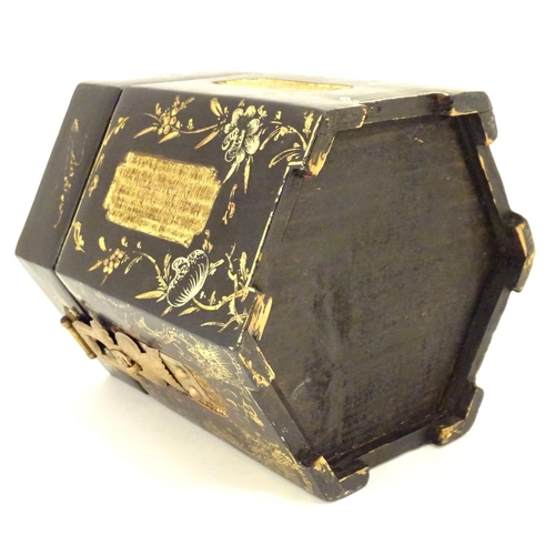 857 - A Chinese lacquer tea caddy of hexagonal form with a hinged lid, scrolling floral and foliate detail... 