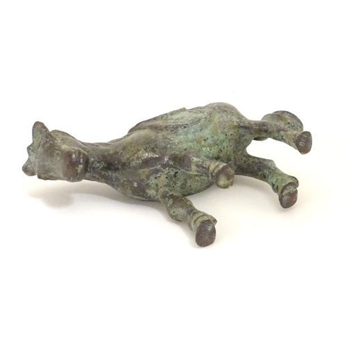 859 - An Oriental bronze model of standing horse with saddle. Approx. 4