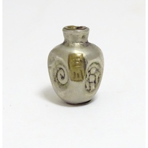 864 - A Japanese silver plate ojime bead formed as a stylised vase with impressed detail and applied brass... 