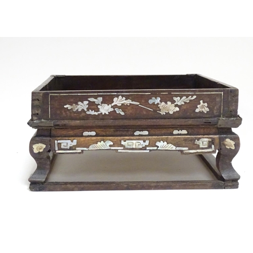 869 - A Chinese hardwood stand of squared form with decorative abalone inlay. Approx. 3 1/2