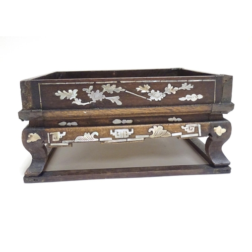 869 - A Chinese hardwood stand of squared form with decorative abalone inlay. Approx. 3 1/2