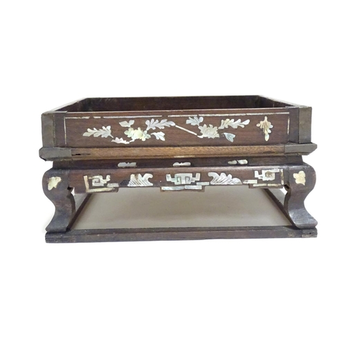 869 - A Chinese hardwood stand of squared form with decorative abalone inlay. Approx. 3 1/2