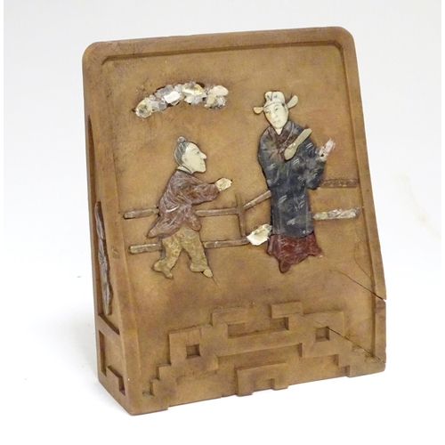 872 - A Chinese carved wooden bookend with inlaid soapstone and shell depicting two figures on a terrace. ... 