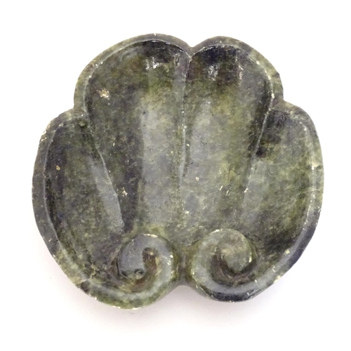 873 - A Chinese carved soapstone dish formed as a stylised leaf with scroll detail. Approx. 4 3/4