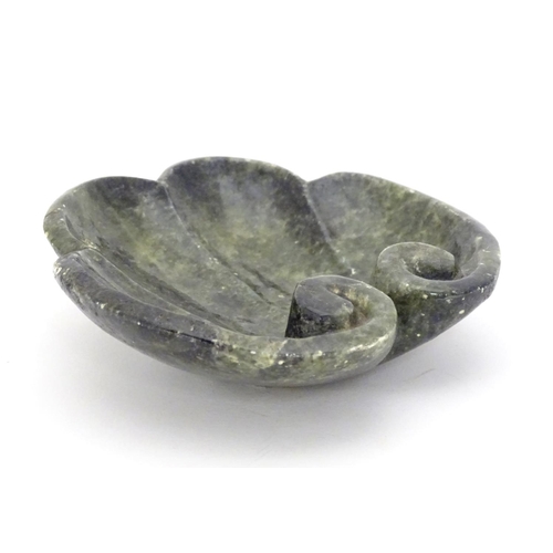 873 - A Chinese carved soapstone dish formed as a stylised leaf with scroll detail. Approx. 4 3/4