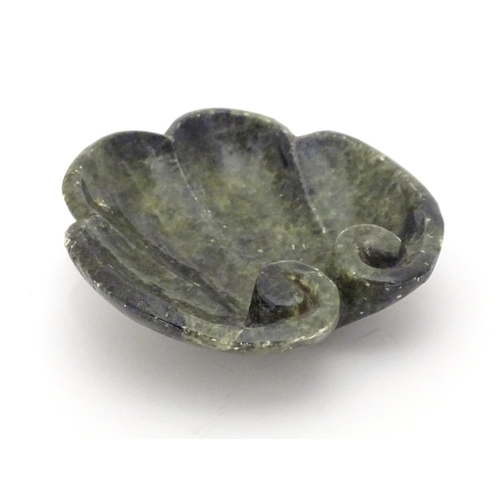 873 - A Chinese carved soapstone dish formed as a stylised leaf with scroll detail. Approx. 4 3/4