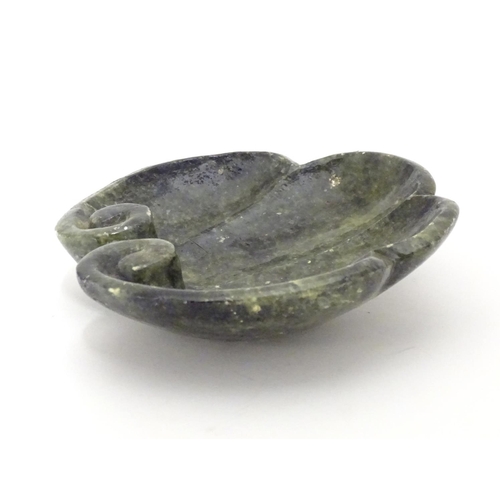 873 - A Chinese carved soapstone dish formed as a stylised leaf with scroll detail. Approx. 4 3/4