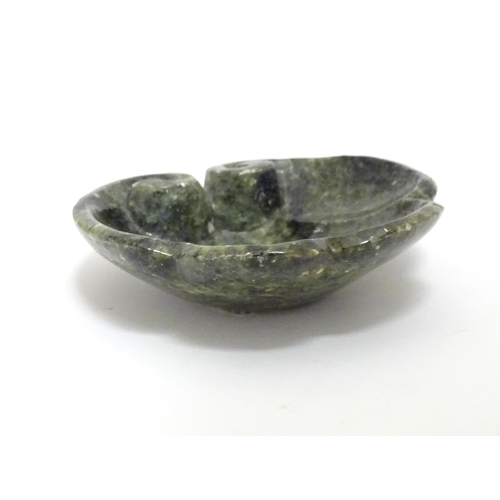 873 - A Chinese carved soapstone dish formed as a stylised leaf with scroll detail. Approx. 4 3/4