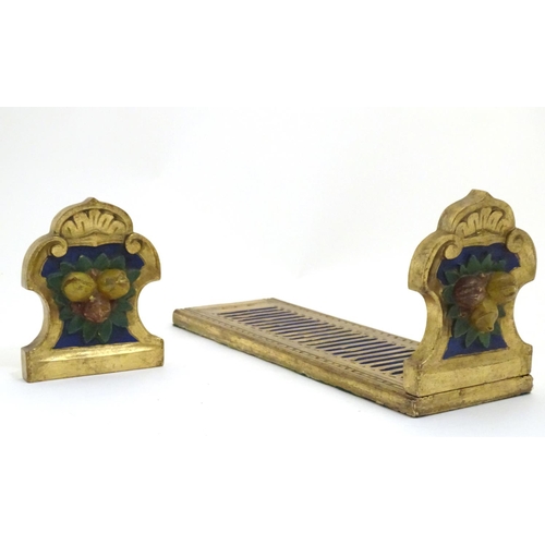 886 - An Italian style carved book slide with gilt and polychrome decoration, the supports decorated with ... 