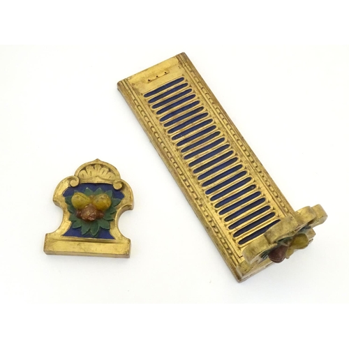 886 - An Italian style carved book slide with gilt and polychrome decoration, the supports decorated with ... 