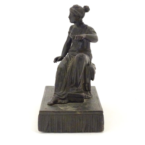 892 - A 19thC bronze figure of a woman seated on an x-frame stool mounted on a fringed rectangular base. A... 