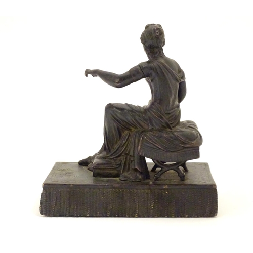 892 - A 19thC bronze figure of a woman seated on an x-frame stool mounted on a fringed rectangular base. A... 