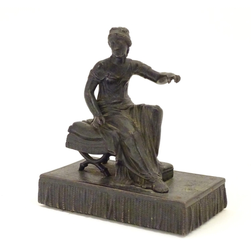 892 - A 19thC bronze figure of a woman seated on an x-frame stool mounted on a fringed rectangular base. A... 