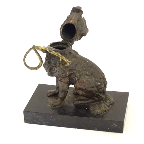 893 - A late 19th / early 20thC bronze desk top inkwell modelled as a dog on a rectangular base. Approx. 5... 