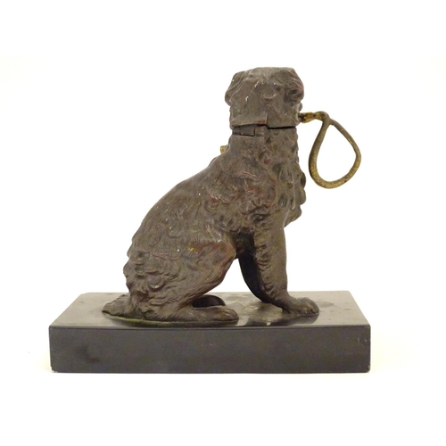 893 - A late 19th / early 20thC bronze desk top inkwell modelled as a dog on a rectangular base. Approx. 5... 