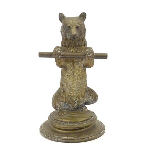 895 - A Victorian novelty brass desk inkwell / standish modelled as a standing bear holding a staff, his h... 