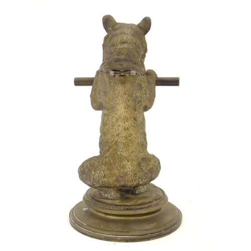 895 - A Victorian novelty brass desk inkwell / standish modelled as a standing bear holding a staff, his h... 