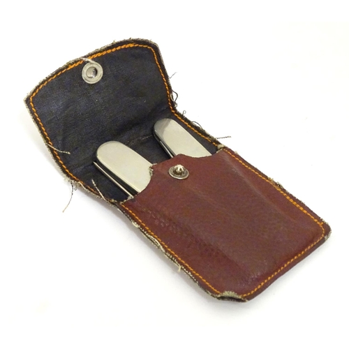 896 - 20thC campaign / folding knife and fork contained within a red leather case. Fork approx. 5 3/4