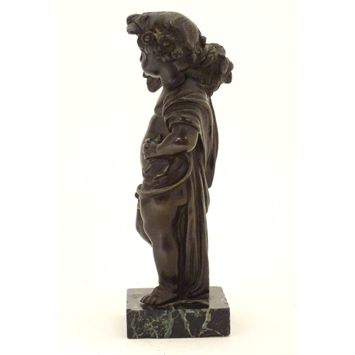 899 - A late 19thC cast bronze figure of a cherub representing Autumn, holding a sheaf of wheat over his s... 