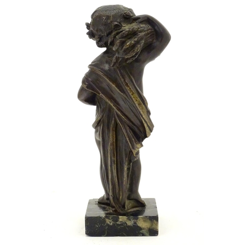 899 - A late 19thC cast bronze figure of a cherub representing Autumn, holding a sheaf of wheat over his s... 