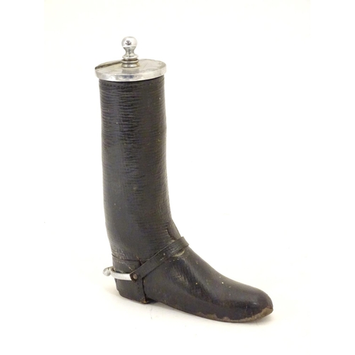 901 - A 20thC table lighter modelled as a riding boot with a leather finish. Approx. 6 1/4