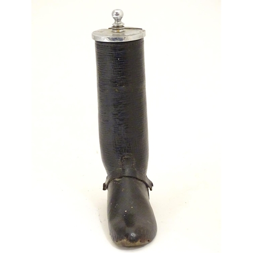 901 - A 20thC table lighter modelled as a riding boot with a leather finish. Approx. 6 1/4