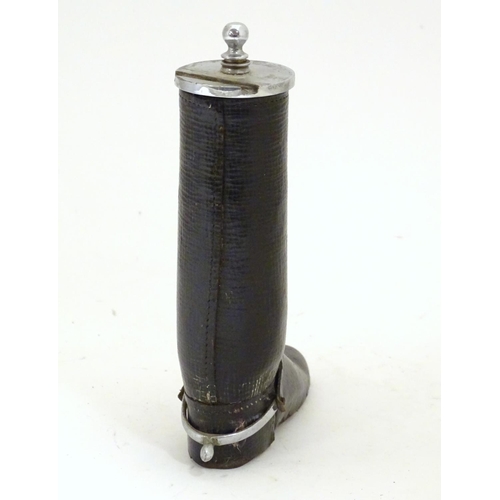 901 - A 20thC table lighter modelled as a riding boot with a leather finish. Approx. 6 1/4