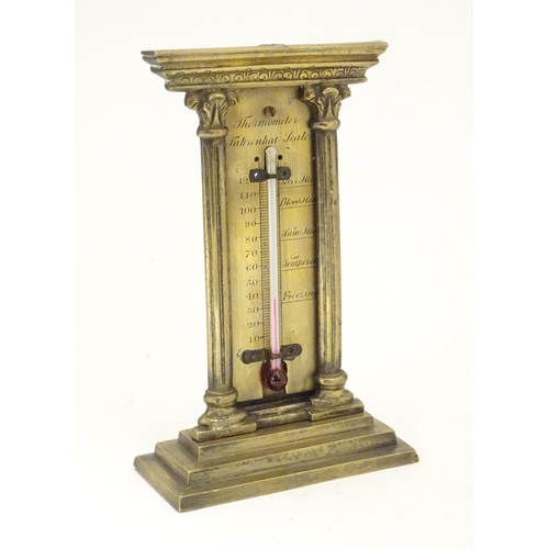 906 - A late 19th / early 20thC brass table top thermometer with a fahrenheit scale within an architectura... 