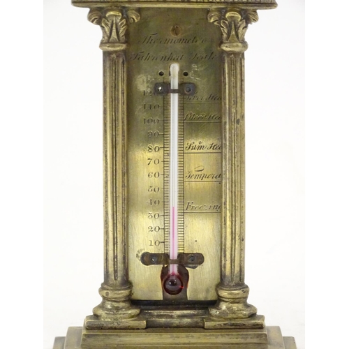 906 - A late 19th / early 20thC brass table top thermometer with a fahrenheit scale within an architectura... 