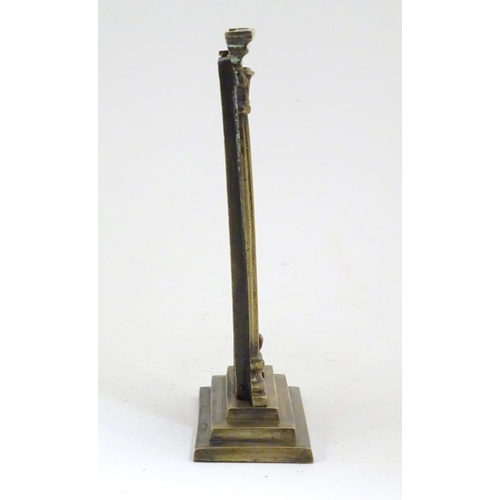 906 - A late 19th / early 20thC brass table top thermometer with a fahrenheit scale within an architectura... 